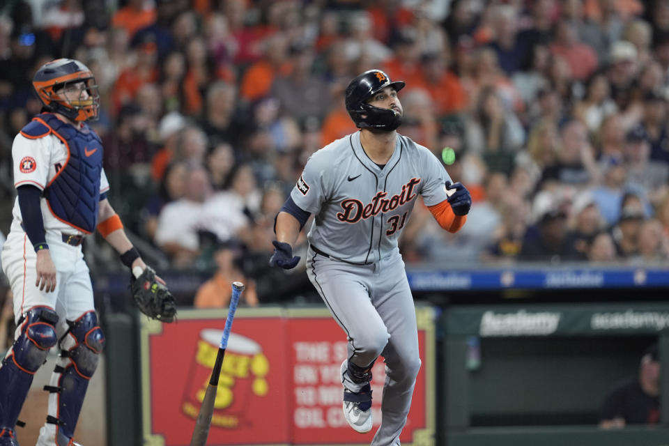 Detroit Tigers' Riley Greene (31) drops his bat after hitting a three-run home run as Houston Astros catcher Victor Caratini watches during the second inning of a baseball game Saturday, June 15, 2024, in Houston. (AP Photo/David J. Phillip)