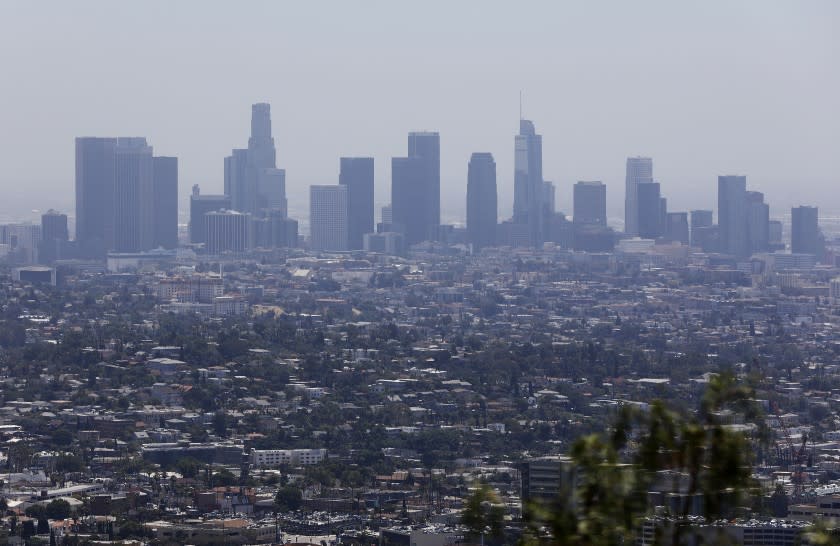 LOS ANGELES-CA-JULY 1, 2019: The downtown Los Angeles skyline is seen from Griffith Observatory on Monday, July 1, 2019. Smog is getting worse in Southern California, and the stakes are high for health and the economy. Officials say it will take $14 billion to fix the problem. (Christina House / Los Angeles Times)