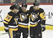 Apr 6, 2018; Pittsburgh, PA, USA; Pittsburgh Penguins right wing Patric Hornqvist (72) Sidney Crosby (87) and Evgeni Malkin (71) celebrate after Crosby scores a goal against the Ottawa Senators in the second period of an NHL game at PPG PAINTS Arena. Mandatory Credit: Don Wright-USA TODAY Sports