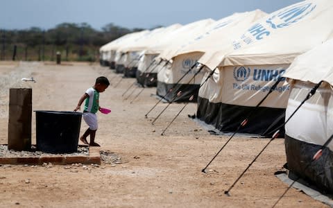 Three million Venezuelans have fled the country, the UN says, including to this refugee camp in Maicao, Colombia  - Credit: Luiza Gonzalez/Reuters