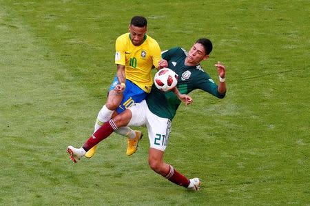 Soccer Football - World Cup - Round of 16 - Brazil vs Mexico - Samara Arena, Samara, Russia - July 2, 2018 Brazil's Neymar in action with Mexico's Edson Alvarez REUTERS/David Gray