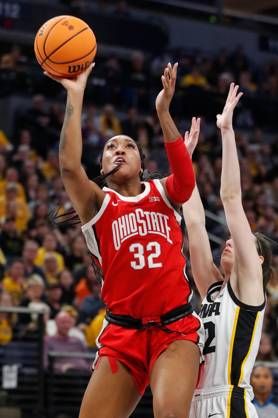 Ohio State's Cotie McMahon shoots over Iowa's Caitlin Clark.