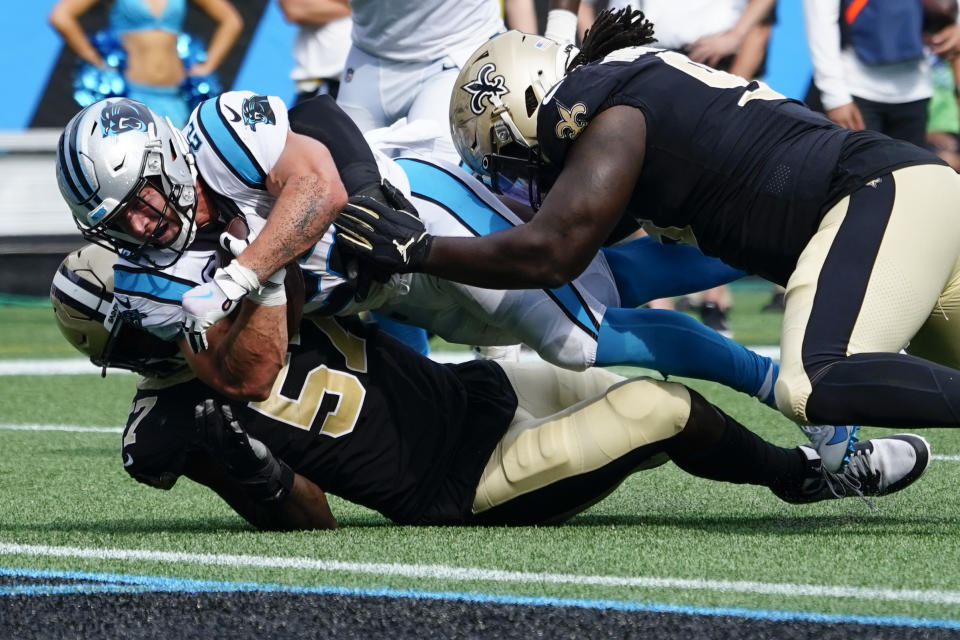 Carolina Panthers running back Christian McCaffrey scores against the New Orleans Saints during the second half of an NFL football game Sunday, Sept. 19, 2021, in Charlotte, N.C. (AP Photo/Jacob Kupferman)