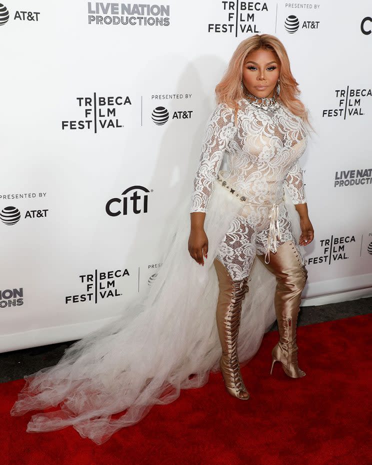 Lil' Kim wears white at the Tribeca Film Festival. (Photo: Getty Images)