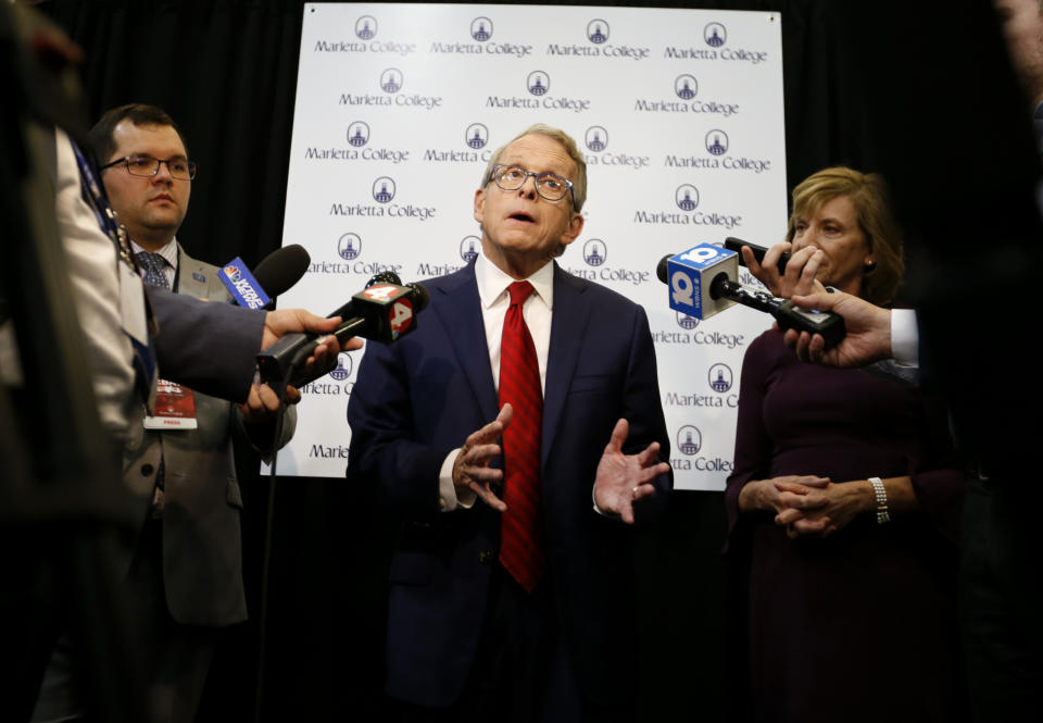 Ohio Attorney General and Republican gubernatorial candidate Mike DeWine answers questions from the media in the spin room following a debate with Democratic gubernatorial candidate Richard Cordray at Marietta College in Marietta, Ohio, Monday, Oct. 1, 2018. (AP Photo/Paul Vernon)