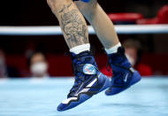 <p>TOKYO, JAPAN - JULY 26: A tatto on the leg of Gabriel Escobar Mascunano of Spain is seen during the Men's Fly (48-52kg) on Day 3 of the Tokyo 2020 Olympic Games at Kokugikan Arena on July 26, 2021 in Tokyo, Japan. (Photo by Buda Mendes/Getty Images)</p> 