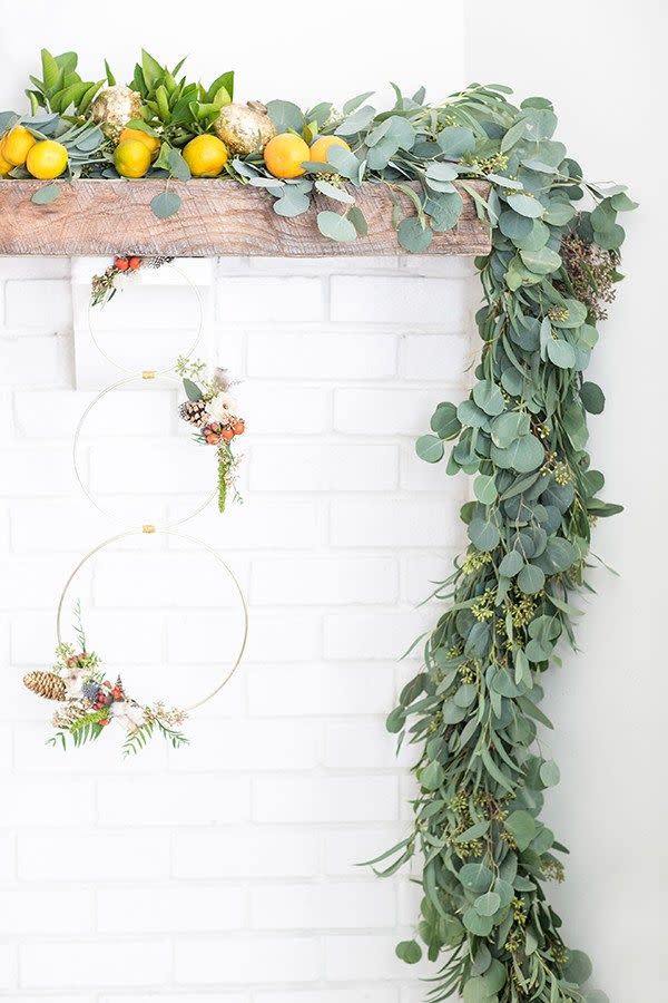 <p>These modern wreaths from <a href="https://sugarandcharm.com/modern-christmas-wreath-and-garland" rel="nofollow noopener" target="_blank" data-ylk="slk:Sugar and Charm;elm:context_link;itc:0;sec:content-canvas" class="link ">Sugar and Charm</a> are the perfect activity for a holiday party. Just set up the supplies on a craft table and print out the simple instructions. </p>