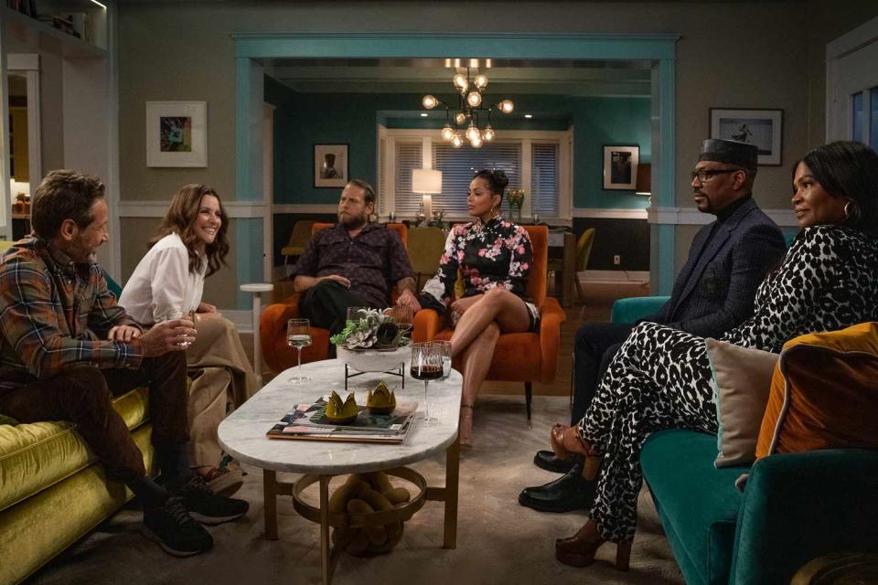 jonah hill, eddie murphy, nia long and others sitting a living room