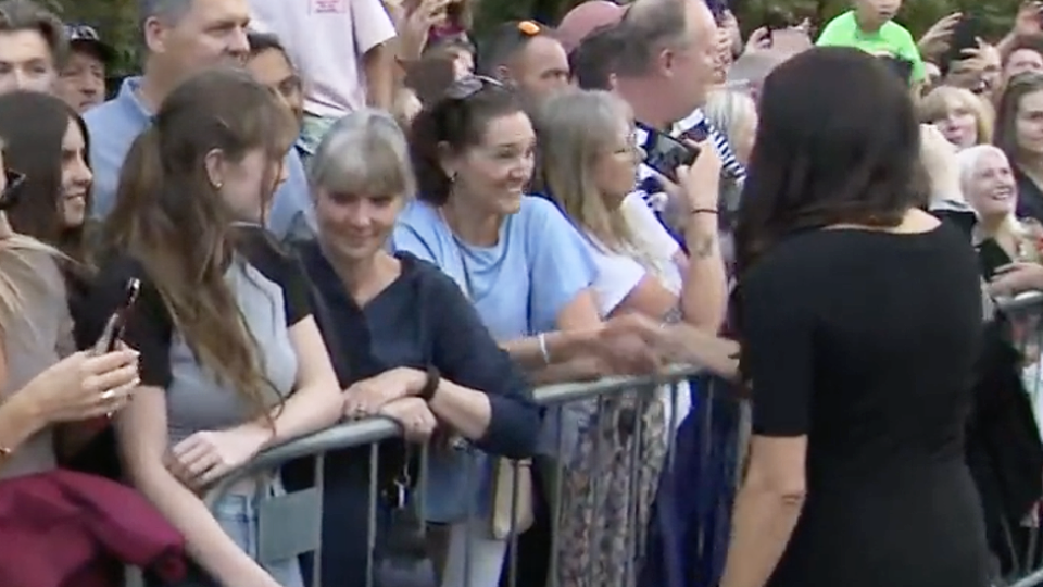 Meghan Markle moving past the mourner who ignored her.