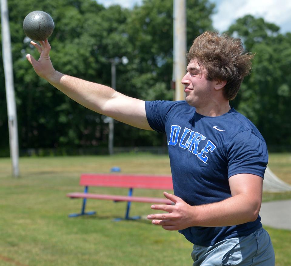 Natick High School graduate Jacob Reinach worked out with coach Kassidy Gallagher at the high school on June 23. Reinach, who will attend Duke University in the fall, is the first Natick High School athlete ever to qualify for the Nationals held in Eugene Oregon, where he placed third in the shot put and fourth in the discus.