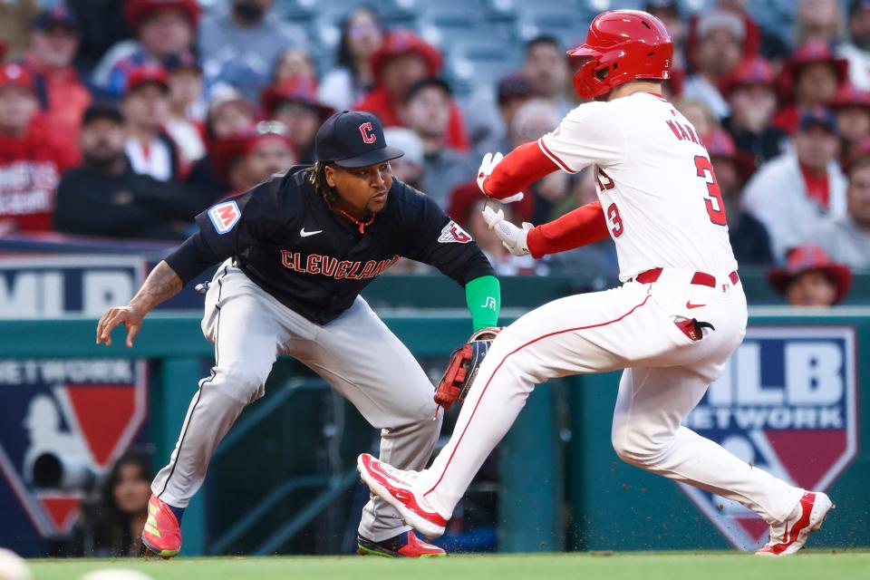 Cleveland Guardians third base José Ramírez (11) tags out Los Angeles Angels' Taylor Ward (3) during the third inning Friday in Anaheim, California.