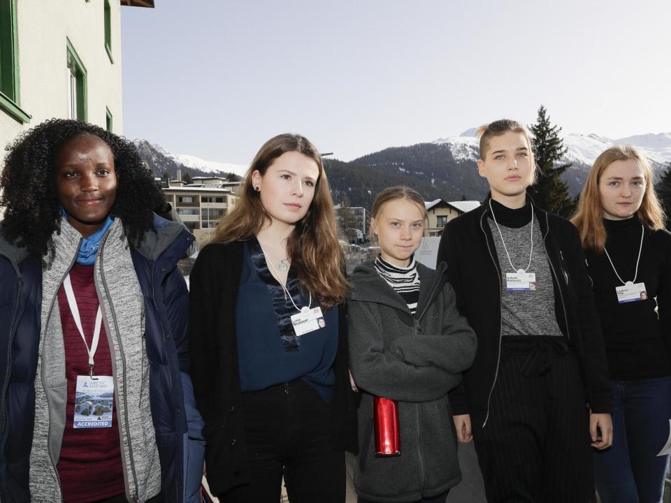 Vanessa Nakate was cut out of the above picture - with Associated Press saying the crop was due to the building behind her being distracted: AP