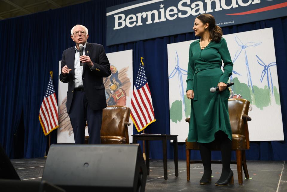 DES MOINES, IA - NOVEMBER 09: Democratic Presidential candidate Bernie Sanders (I-VT) and U.S. Rep. Alexandria Ocasio-Cortez (D-NY) field questions from audience members at the Climate Crisis Summit at Drake University on November 9, 2019 in Des Moines, Iowa. Ocasio-Cortez joined Sanders in Iowa to speak about the current state of climate change in relation to U.S. policy. (Photo by Stephen Maturen/Getty Images) ORG XMIT: 775432742 ORIG FILE ID: 1181129292