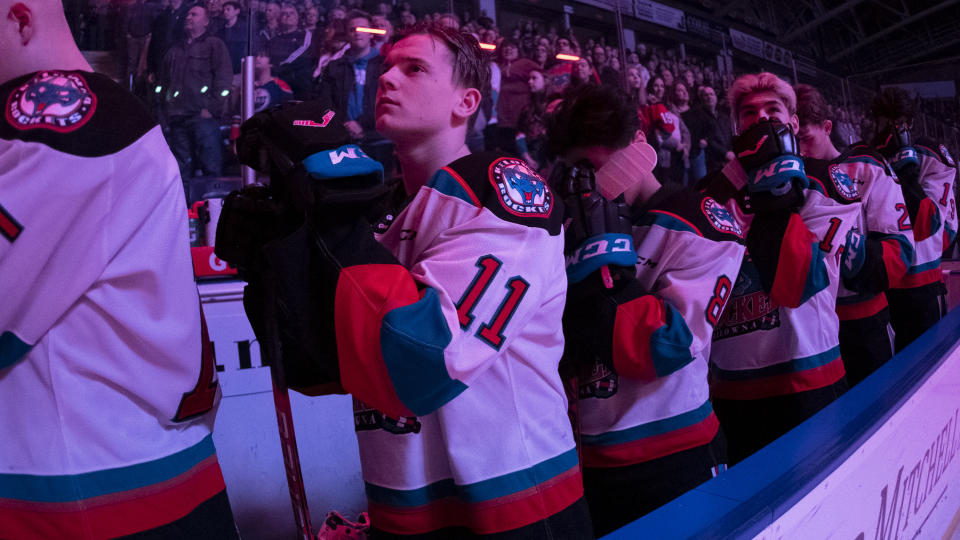 KELOWNA, BC - MARCH 7: Pavel Novak #11 of the Kelowna Rockets stands on the bench for the national anthem against the Lethbridge Hurricanes at Prospera Place on March 7, 2020 in Kelowna, Canada. (Photo by Marissa Baecker/Getty Images )