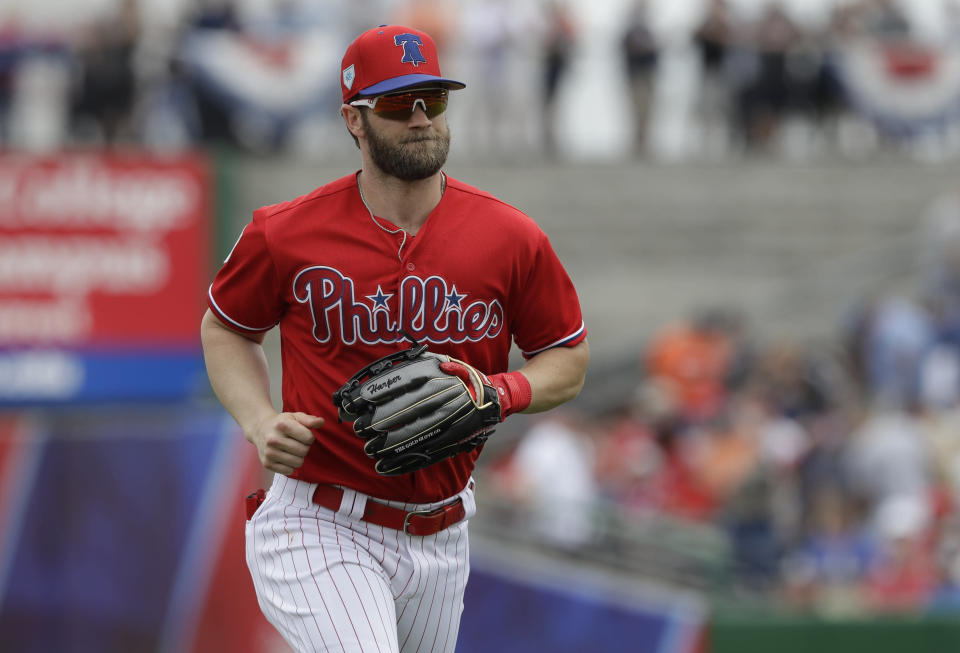 Philadelphia Phillies right fielder Bryce Harper runs to the dugout during the second inning of a spring training baseball game against the Detroit Tigers Wednesday, March 20, 2019, in Clearwater, Fla. (AP Photo/Chris O'Meara)