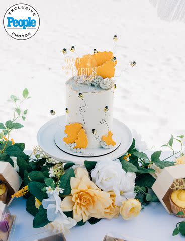 <p>Caitlyn Torres Photography</p> The bee-themed cake