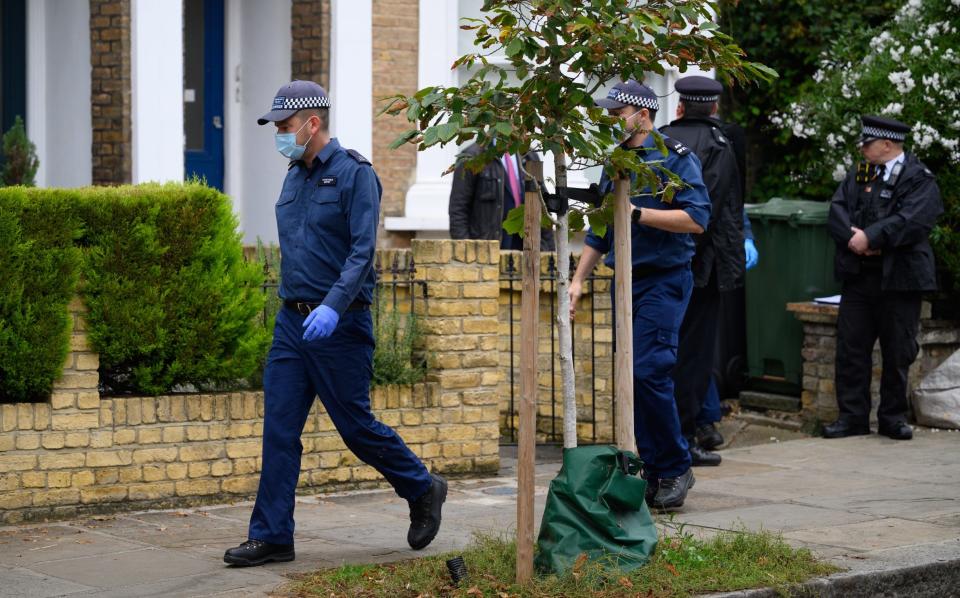 Police searching a property in Kentish Town, North London. It is reported that Mr Ali was living there - Leon Neal/Getty Images