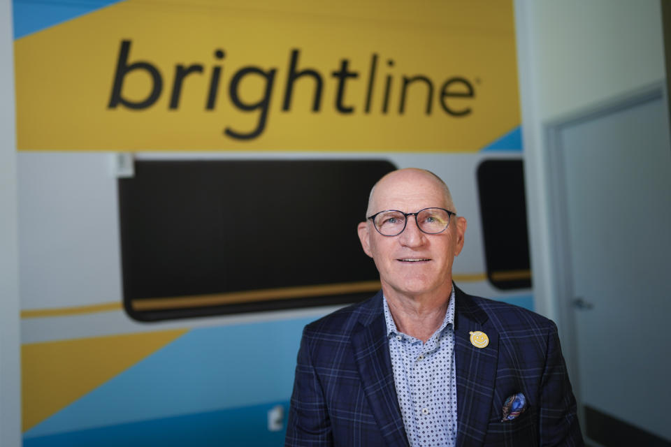 Brightline CEO Mike Reininger poses for a portrait in the company's corporate offices, Monday, Sept. 18, 2023, in downtown Miami. The first big test of whether privately owned high-speed passenger train service can prosper in the United States will launch Friday when Florida's Brightline begins running trains between Miami and Orlando, reaching speeds of 125 mph (200 kph). (AP Photo/Rebecca Blackwell)