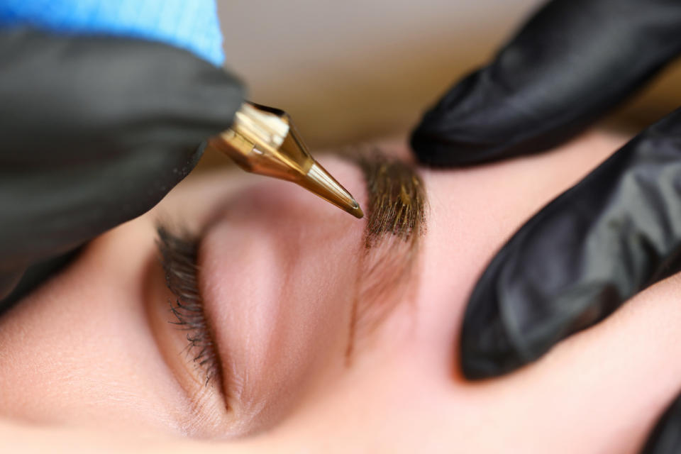 woman getting microblading treatment