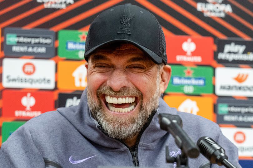 Liverpool's German manager Jurgen Klopp (L) and Liverpool's Argentinian midfielder Alexis Mac Allister laugh during a press conference on March 6, 2024 in Prague on the eve of the UEFA Europa League football match between Liverpool and AC Sparta Prague.