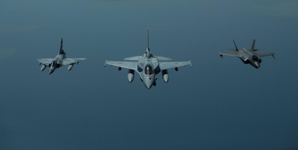 FILE PHOTO: A United Arab Emirates Air Force Mirage 2000 (L), UAE F-16 Desert Falcon (C) and a U.S. F-35A Lightning II (R) fly a partnering flight in the U.S. Central Command area of responsibility, in the Arabian Gulf, May 29, 2019. Picture taken May 29, 2019. Chris Drzazgowski/U.S. Navy/Handout via REUTERS