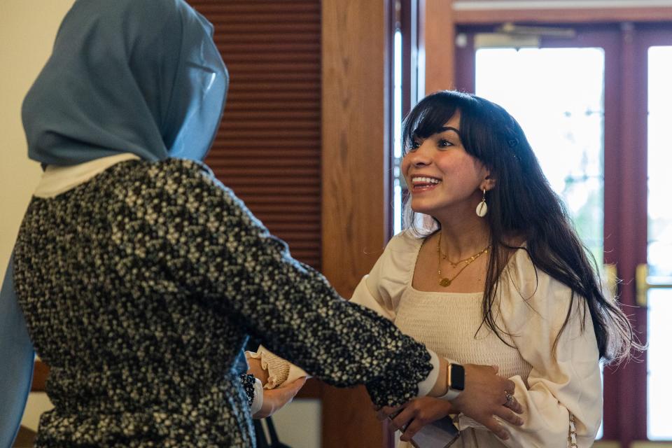 Walaa Hmeida, a graduate of Utah State University, hugs Alaa Al-Barkawi during the One Refugee graduation celebration at the Garden Place at Heritage Park in Salt Lake City on May 8, 2023. | Ryan Sun, Deseret News