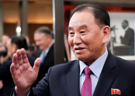 FILE PHOTO: Vice Chairman of the North Korean Workers' Party Committee Kim Yong Chol, North Korea's lead negotiator in nuclear diplomacy with the United States, waves as he meets with U.S. Secretary of State Mike Pompeo (reflected in background 2ndL) for talks aimed at clearing the way for a second U.S.-North Korea summit in Washington, U.S., January 18, 2019. REUTERS/Joshua Roberts/File Photo