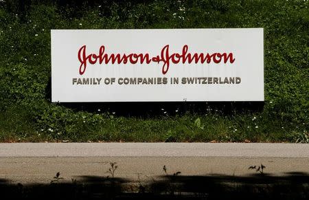 The logo of healthcare company Johnson & Johnson is seen in front of an office building in Zug, Switzerland July 20, 2016. REUTERS/Arnd Wiegmann