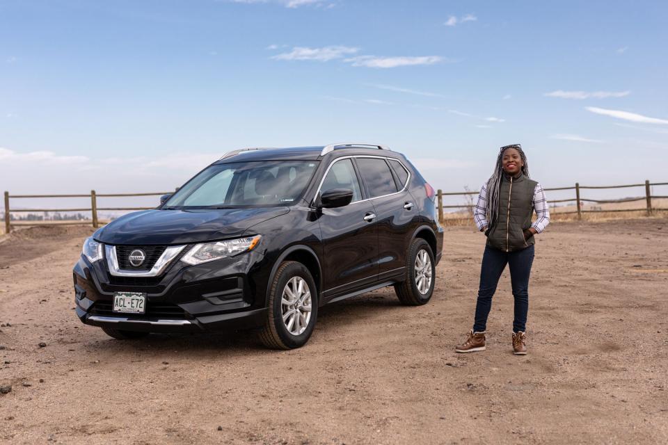 car owner standing with car