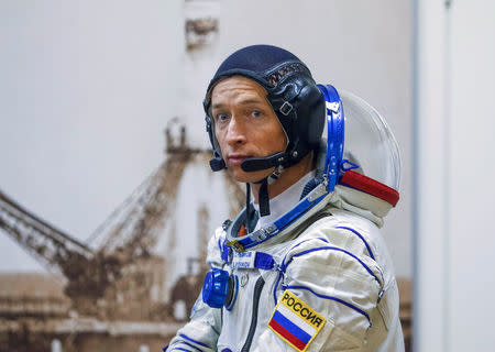 The International Space Station (ISS) crew member Sergey Ryzhikov of Russia looks on after donning a space suit at the Baikonur cosmodrome, Kazakhstan October 19, 2016. REUTERS/Shamil Zhumatov