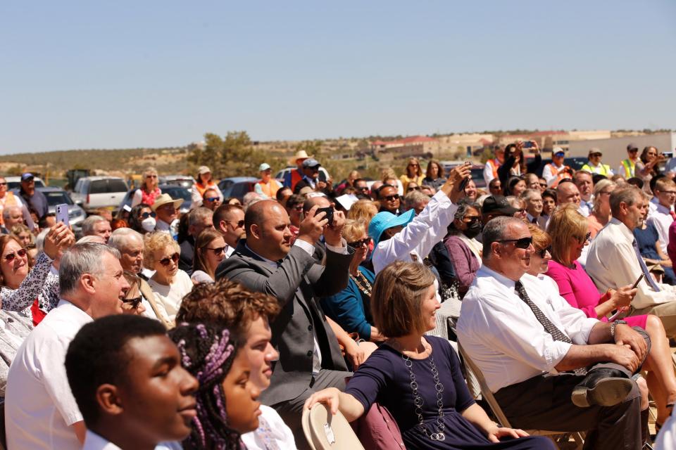 Members of The Church of Jesus Christ of Latter-day Saints and invited guests watch on April 30 Church officials and dignitaries break ground on the new temple in Farmington.