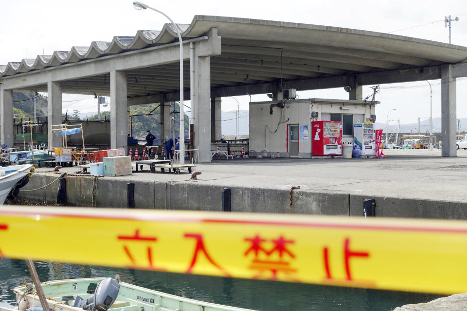 CORRECTS PORT'S NAME - Japanese police continued their investigation at the Saikazaki port, the Wakayama prefecture Sunday, April 16, 2023, where a man threw an explosive in the direction of Prime Minister Fumio Kishida just before his campaign speech began in Wakayama, western Japan. (AP Photo/Mari Yamaguchi)