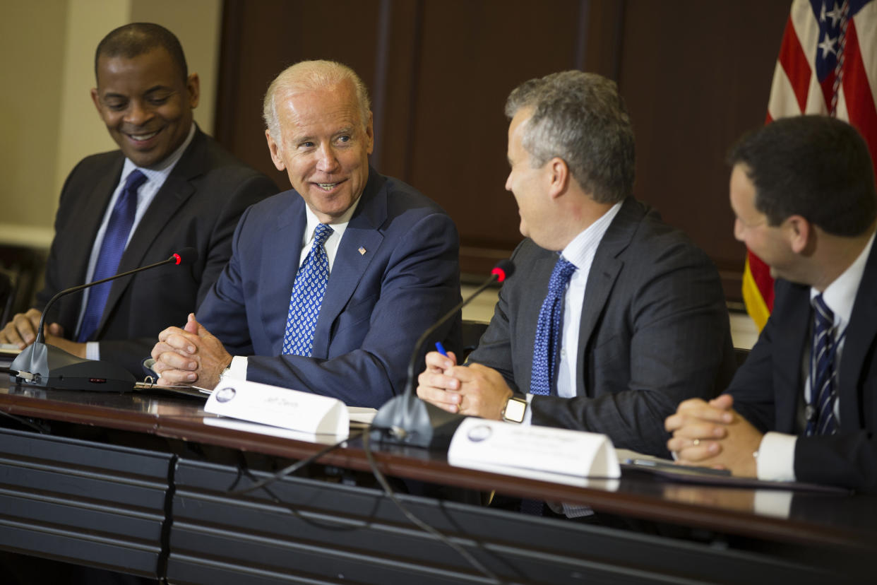 Vice President Joe Biden speaks during the White House Build America Investment Initiative roundtable, in 2015, in the Eisenhower Executive Office Building on the White House complex in Washington. From left are, Transportation Secretary Anthony Foxx, Biden, National Economic Council Director Jeff Zients, and Senior Policy Adviser at the National Economic Jake Broder-Fingert. (Evan Vucci/AP)