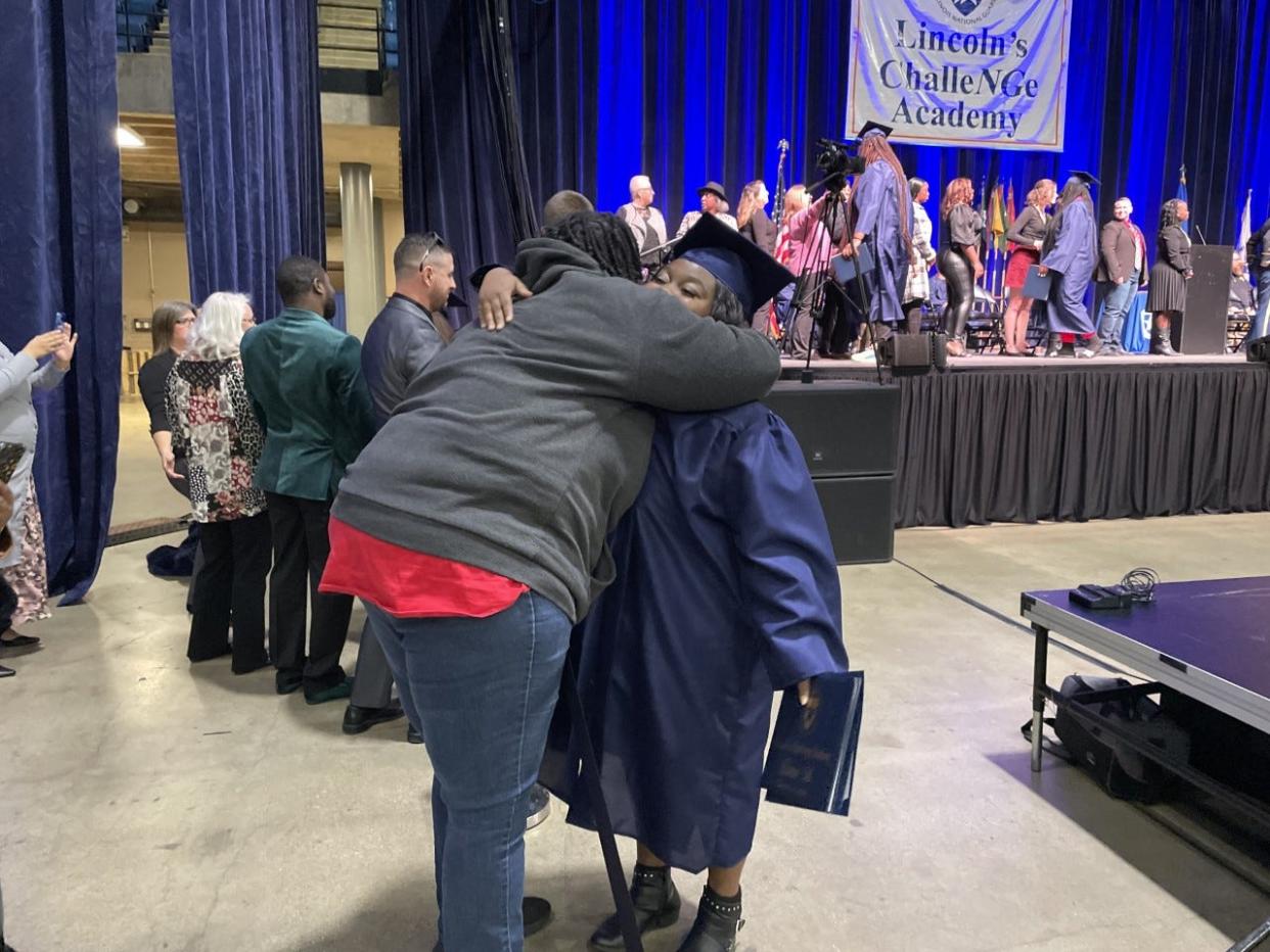 Cadet Shamira Elms of Springfield hugs her mentor, Jeanette Goza, during the Lincoln's ChalleNGe Academy graduation ceremony Saturday at the Bank of Springfield Center.