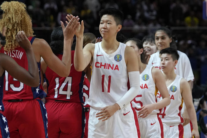 China's players, right, shake hands with the United States' players following their gold medal game at the women's Basketball World Cup in Sydney, Australia, Saturday, Oct. 1, 2022. (AP Photo/Rick Rycroft)