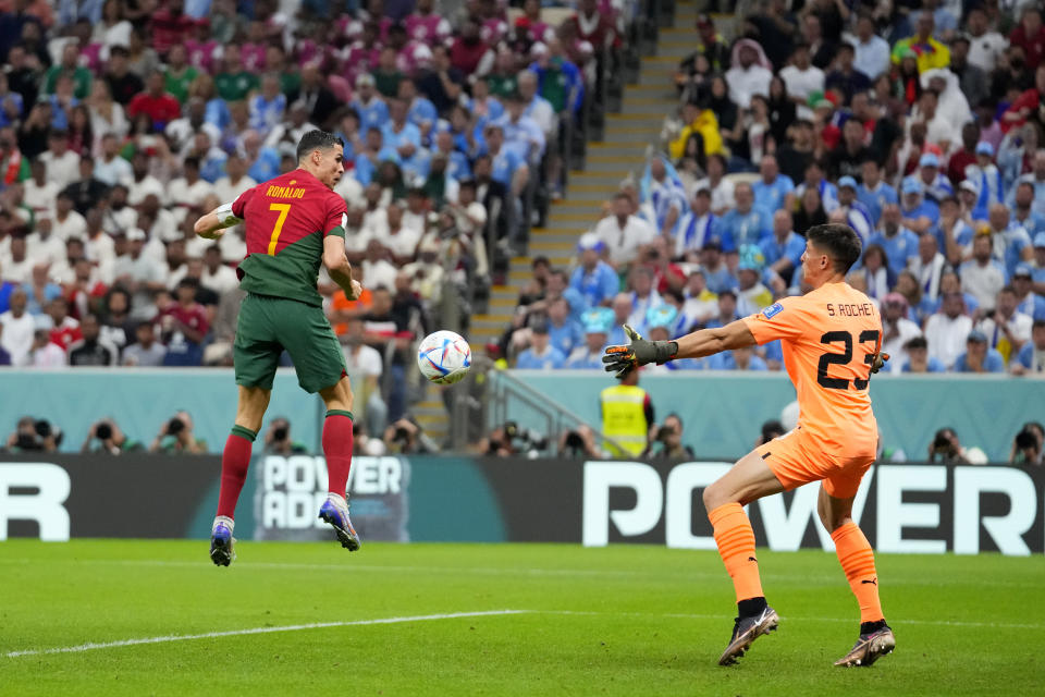 Portugal's Cristiano Ronaldo scores the opening goal during the World Cup group H soccer match between Portugal and Uruguay, at the Lusail Stadium in Lusail, Qatar, Monday, Nov. 28, 2022. (AP Photo/Petr David Josek)