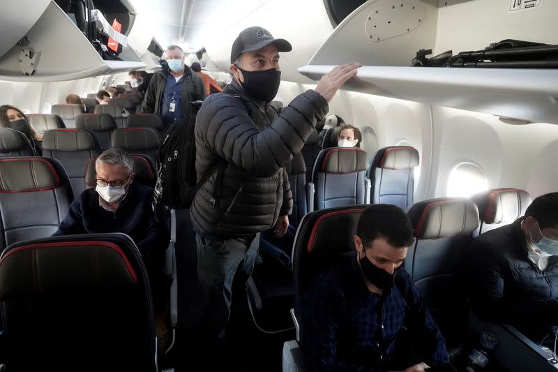 People depart a Boeing 737 Max airplane at Dallas Fort Worth Airport following a media flight to Tulsa