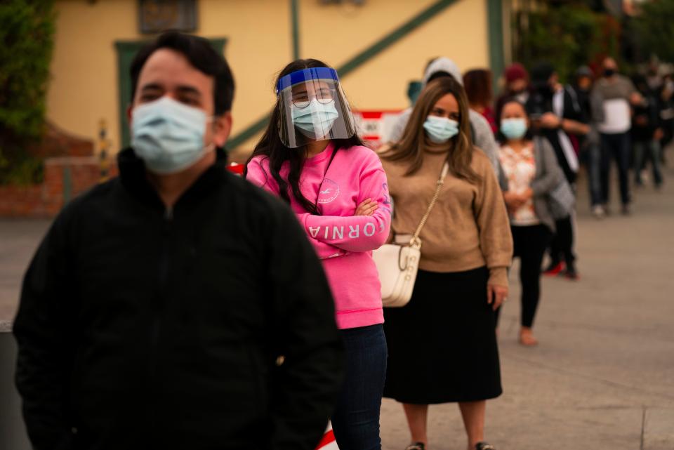 People stand in line for coronavirus testing in Los Angeles (AP)