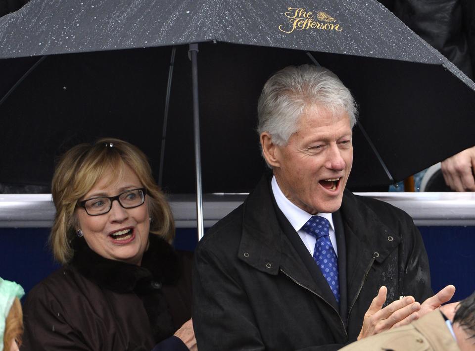 Former U.S. President Bill Clinton (R) and his wife Hillary attend the swearing-in ceremony of Terry McAuliffe as Virginia's governor in Richmond, Virginia, January 11, 2014. REUTERS/Mike Theiler (UNITED STATES - Tags: POLITICS)