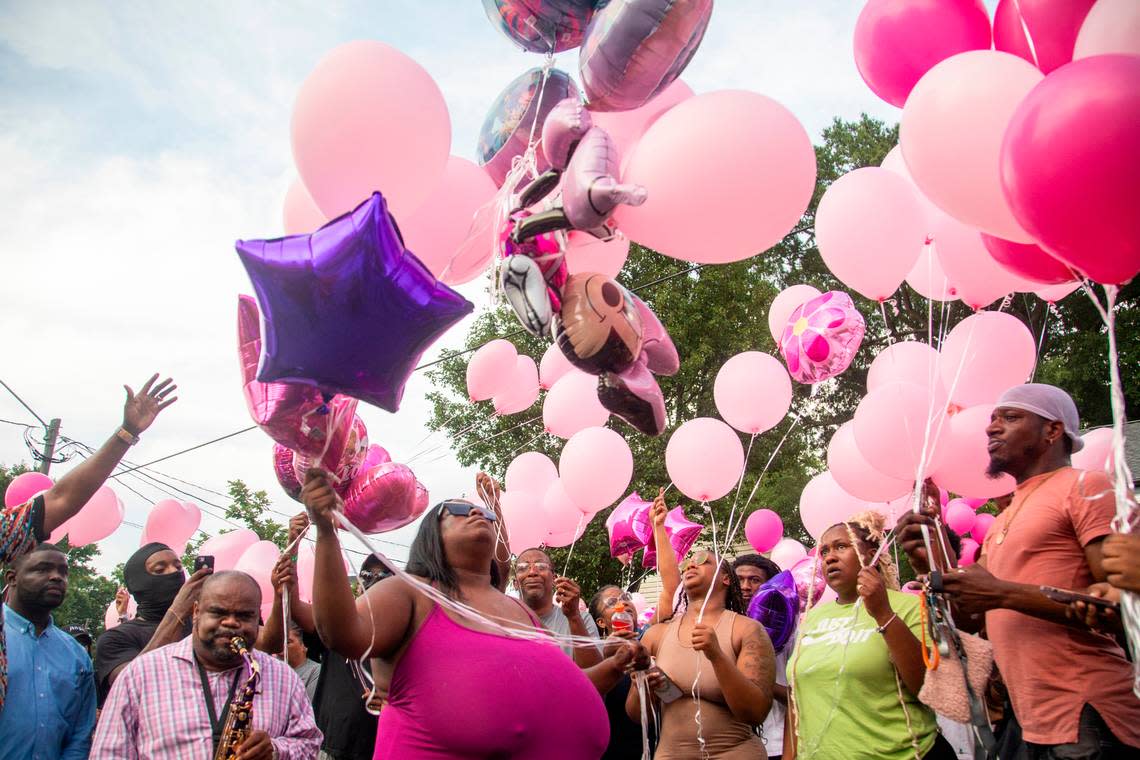 Brittany Dash, the mother of 5-year-old Khloe Fennell, center, releases balloons with family, friends and neighbors during a vigil Friday, July 7, 2023 in Durham. Khloe was shot and killed on Wednesday. Her 15-year-old cousin was babysitting her. She was shot multiple times and survived.