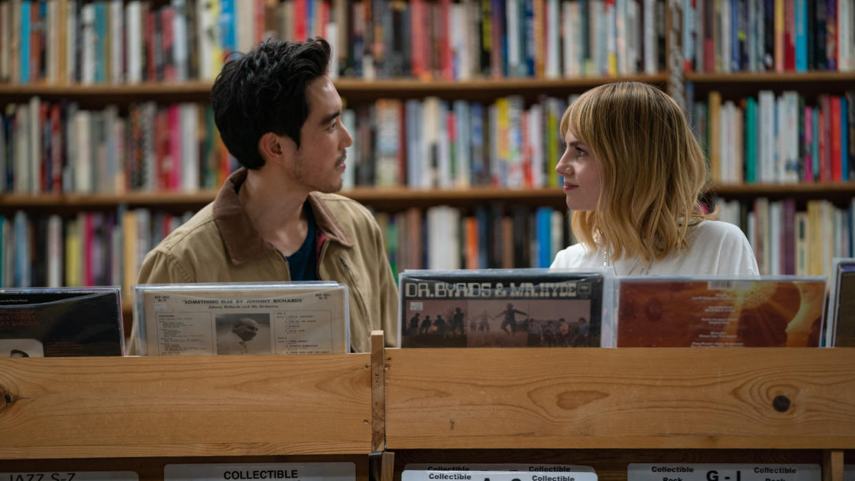  Harriet and her new love interest stare intently at each other in a record store in The Greatest Hits movie. 