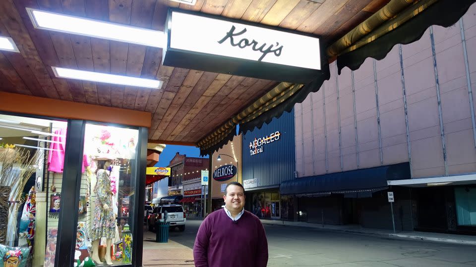 Evan Kory poses for a photo near his store in Nogales, Arizona. - CNN