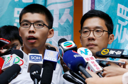 Pro-democracy activist Joshua Wong (L) and Nathan Law are interviewed outside the Court of Final Appeal after being granted bail in Hong Kong, China, October 24, 2017. REUTERS/Bobby Yip