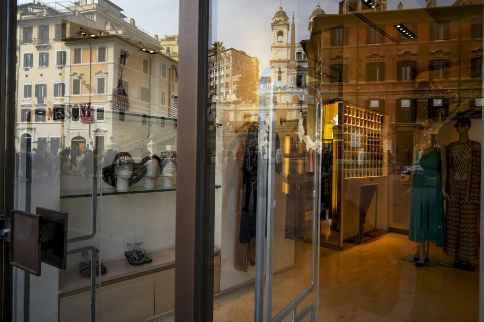The Spanish Steps are reflected in the window of an empty shop, in Rome, Thursday, March 5, 2020. Italy's virus outbreak has been concentrated in the northern region of Lombardy, but fears over how the virus is spreading inside and outside the country has prompted the government to close all schools and Universities nationwide for two weeks. (AP Photo/Andrew Medichini)