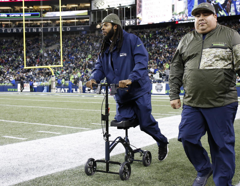 SEATTLE, WA - NOVEMBER 20: Cornerback Richard Sherman #25 of the Seattle Seahawks wheels along the sidelines, out with an Achilles injury, during the game agains the Atlanta Falcons at CenturyLink Field on November 20, 2017 in Seattle, Washington.  (Photo by Otto Greule Jr/Getty Images)