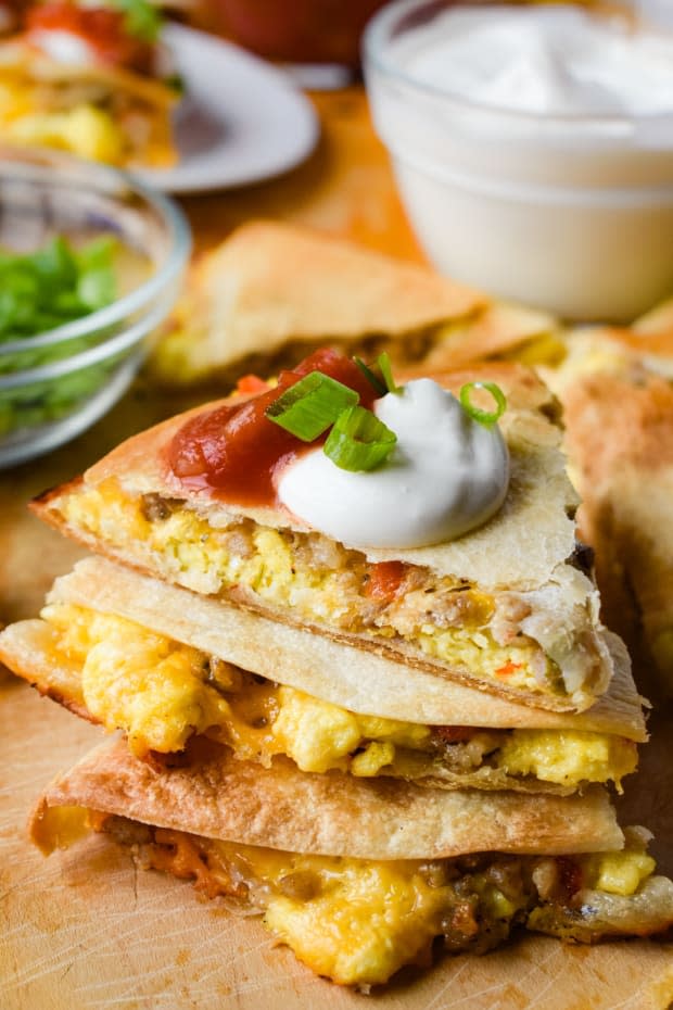 <p>Eggs, melty cheese and meat fill these sheet pan breakfast quesadillas which make for a crave-able breakfast that’s sure to get you outta bed!</p><p><strong>Get the recipe: <a href="https://dancearoundthekitchen.com/2020/09/02/sheet-pan-breakfast-quesadillas/" rel="nofollow noopener" target="_blank" data-ylk="slk:Sheet Pan Breakfast Quesadillas;elm:context_link;itc:0;sec:content-canvas" class="link "><em>Sheet Pan Breakfast Quesadillas</em></a></strong></p><p>Dance Around the Kitchen</p>