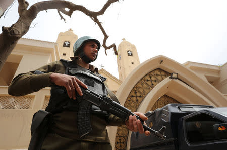 An armed policeman secures the Coptic church that was bombed on Sunday in Tanta, Egypt April 10, 2017. REUTERS/Mohamed Abd El Ghany