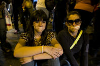 Protesters with their mouths covered with tape protest the detention of four students in Caracas, Venezuela, Saturday, Feb. 8, 2014. The detained students were arrested in Tachira state on Friday while protesting crime. The protests are part of a civil movement called "Street with no return" that is calling for street protests against the government of Venezuela's President Nicolas Maduro. (AP Photo/Alejandro Cegarra)