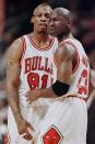 Michael Jordan(R) of the Chicago Bulls pulls teammate Dennis Rodman away after Rodman was called for a technical foul 27 May during the first half of game five of the NBA Eastern Conference finals at the United Center in Chicago, Il. The series is tied 2-2. AFP PHOTO/Jeff HAYNES (Photo by JEFF HAYNES / AFP) (Photo credit should read JEFF HAYNES/AFP via Getty Images)