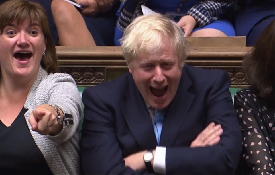 Nicky Morgan sits alongside Boris Johnson in the House of Commons (AFP/Getty Images)